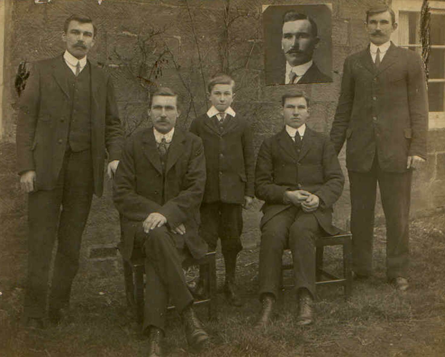 A group of people posing for a photo
Description automatically generated